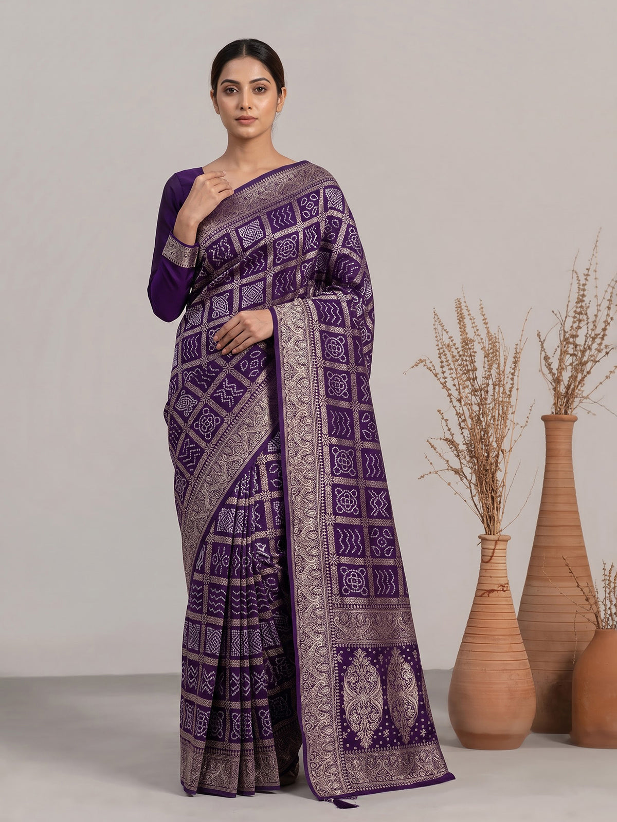 Purple dola silk bandhani saree with luxurious tassel pallu detailing