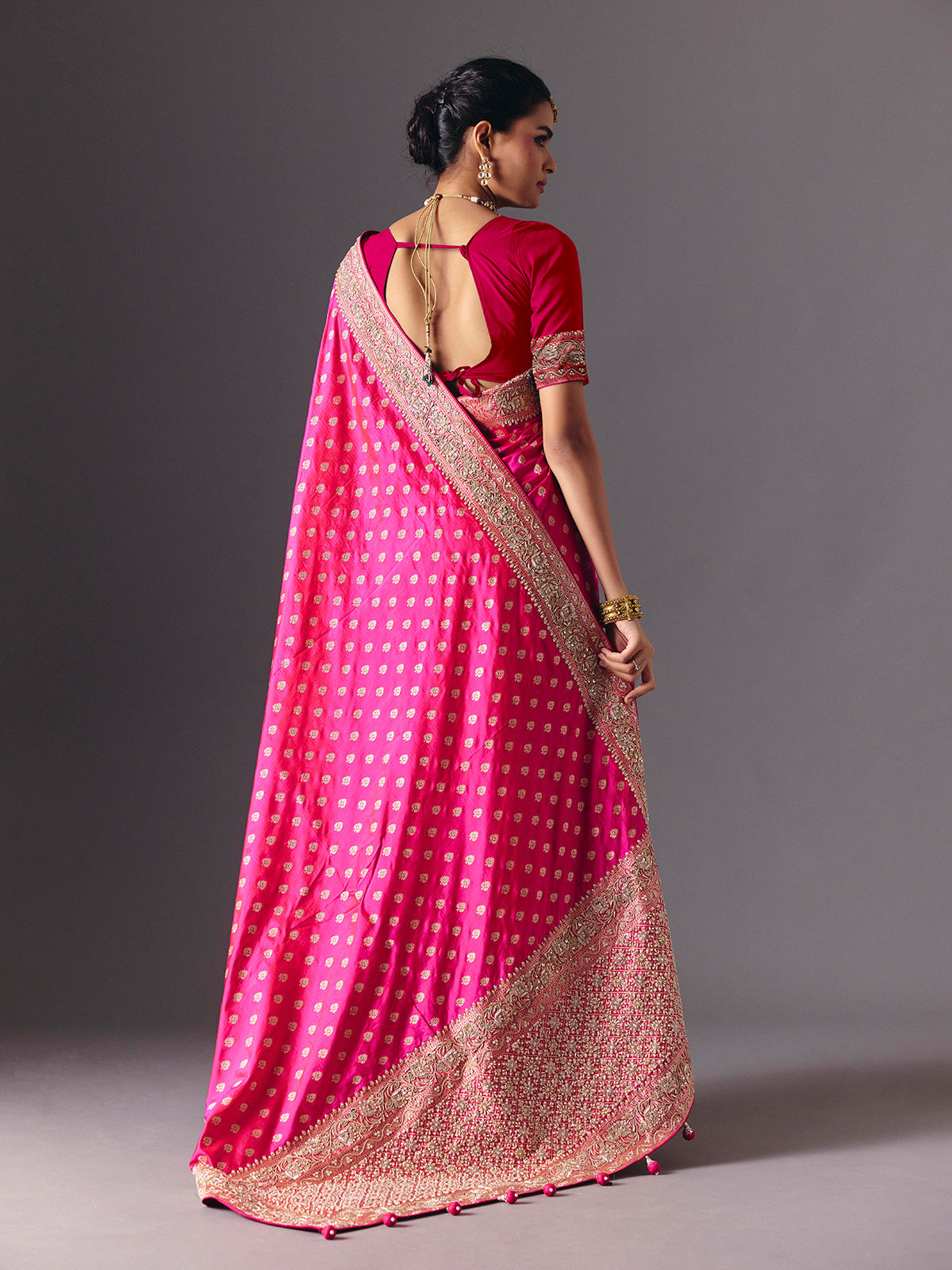 Rani pink banarasi silk saree with butti work and tassels