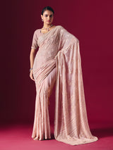 Blush pink Lucknowi georgette saree with elegant chikankari handcrafted detailing