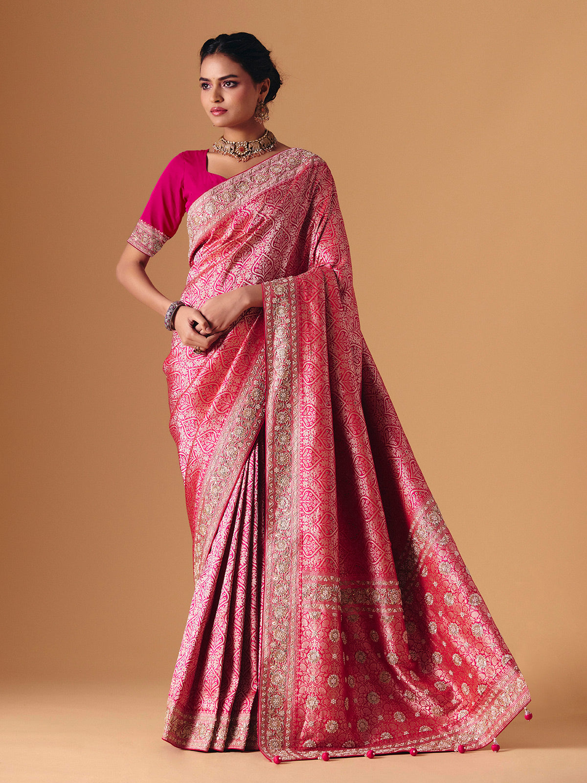 Magenta pink banarasi silk saree with regal embellished bridal elegance
