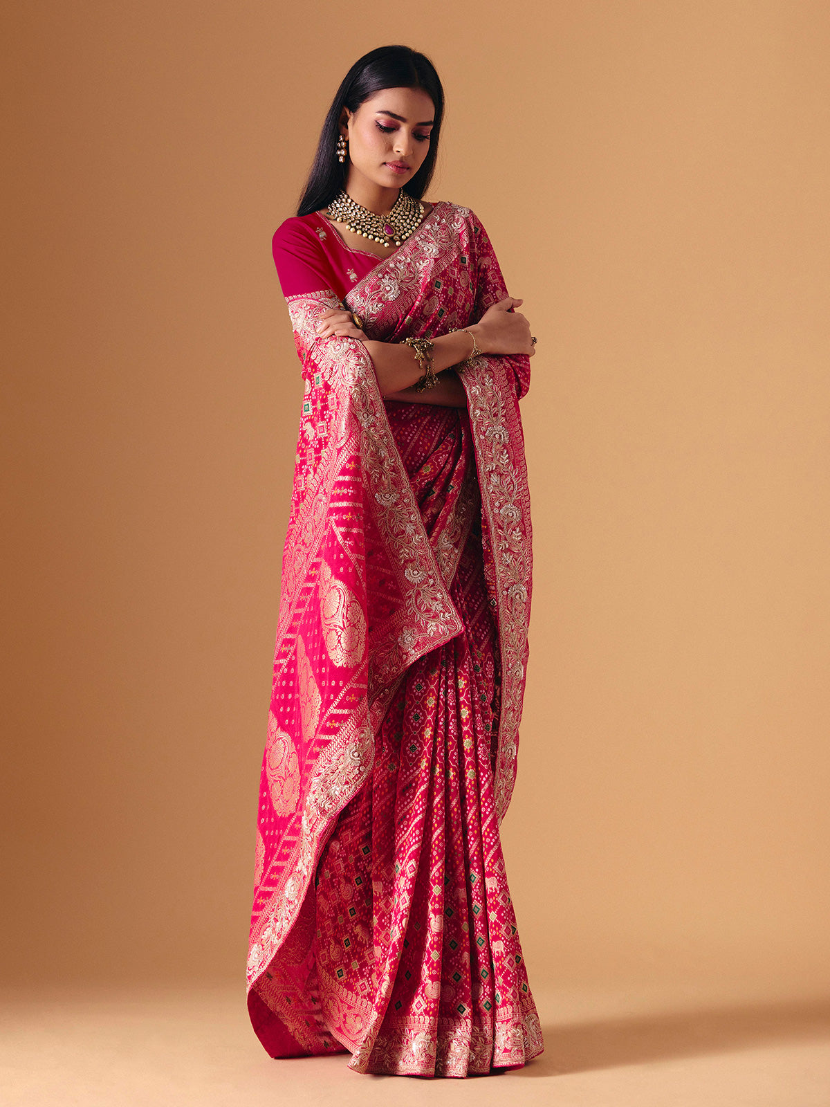 Deep pink georgette bridal saree with zardosi embellished elegance