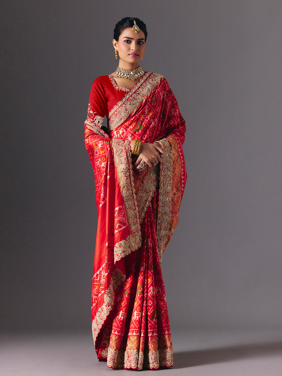 Red Hyderabadi patola silk saree with luxurious printed bridal artistry