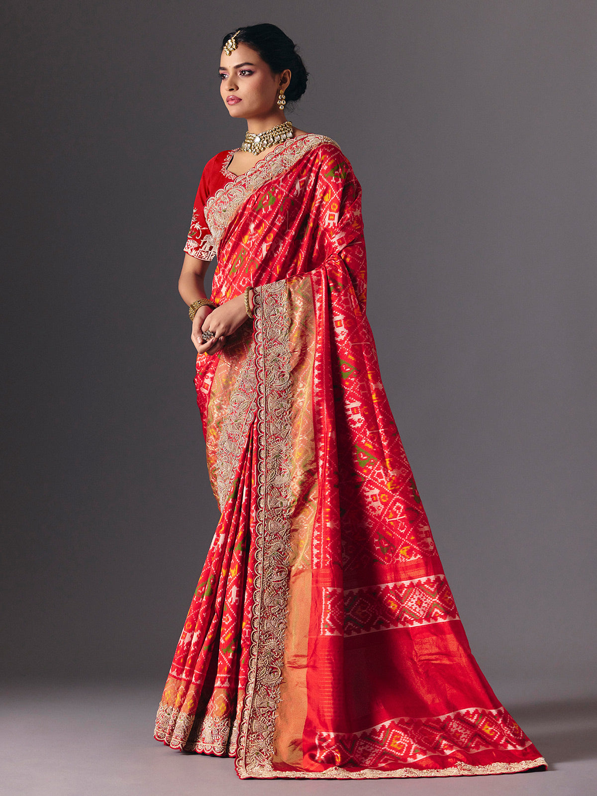 Red Hyderabadi patola silk saree with luxurious printed bridal artistry
