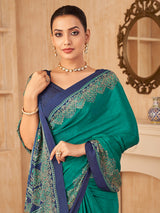 Peacock green printed contrast border crepe silk saree