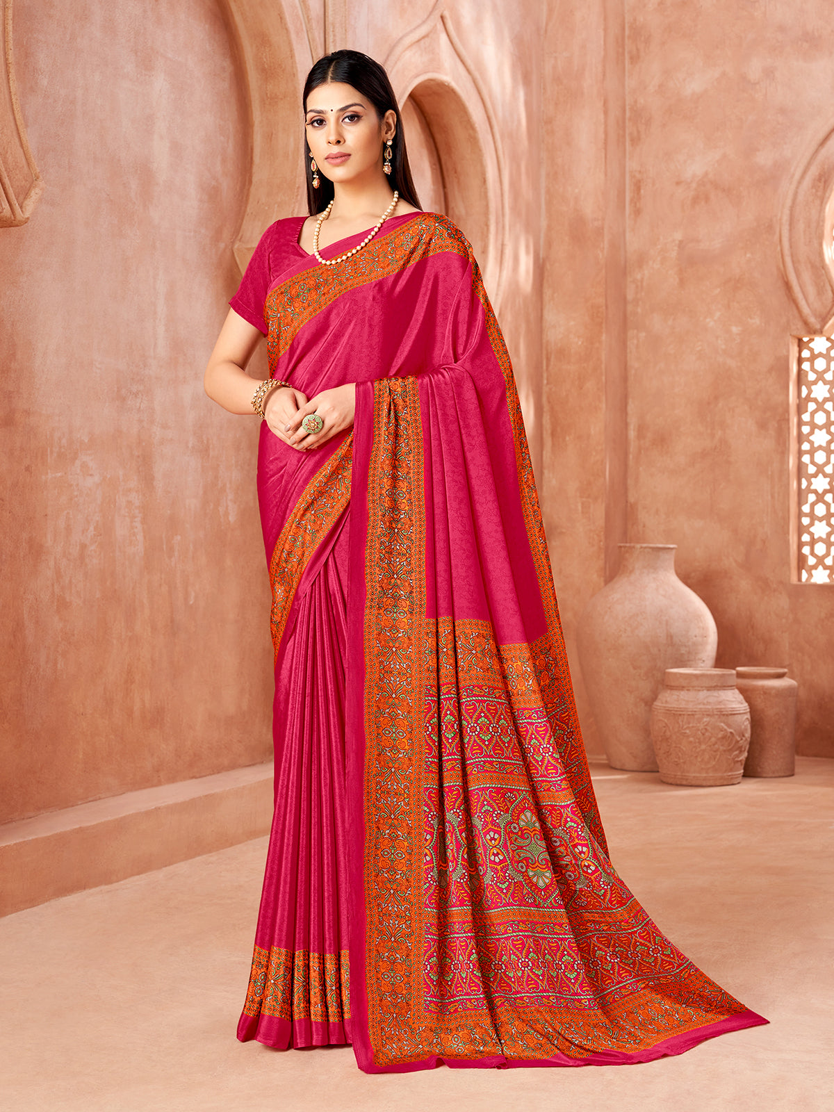Rani pink printed contrast border and pallu crepe silk saree