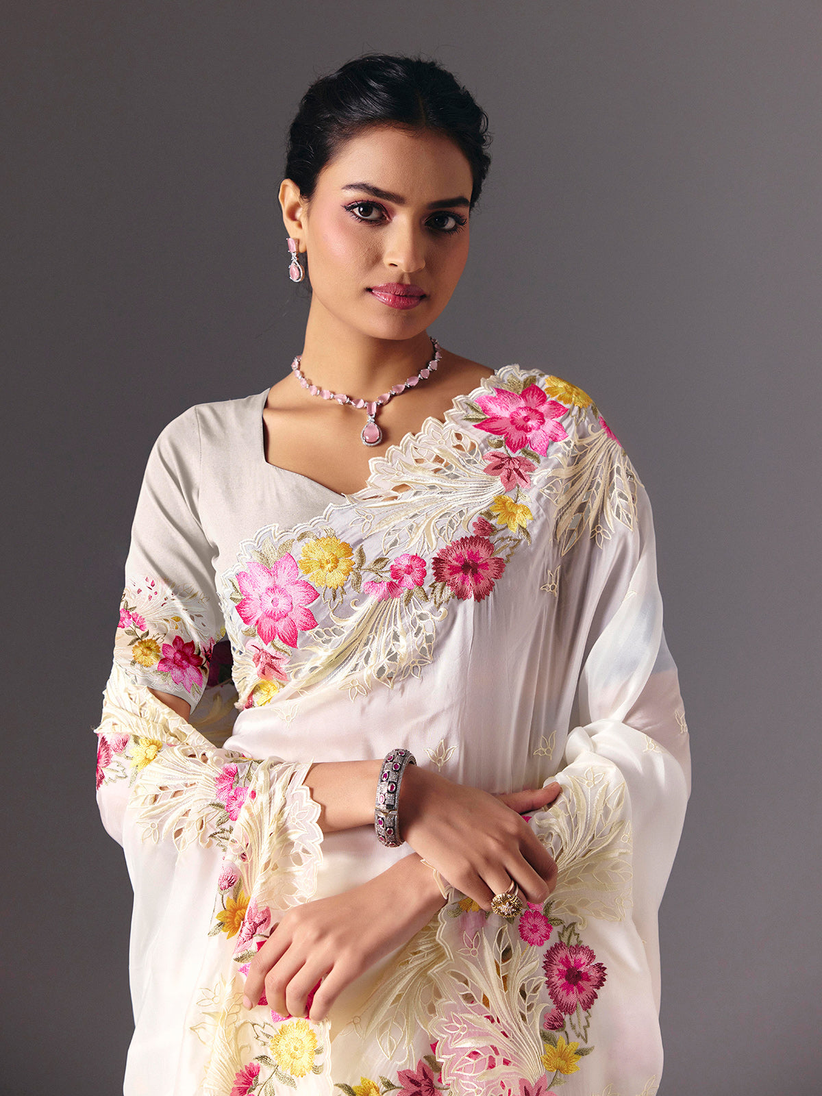 White organza floral embroidered saree with elegant cutwork detailing