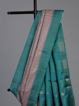 Beige tusser silk saree with regal zari border detailing