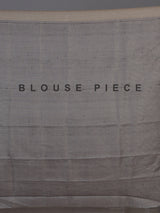 Pastel beige semi tusser silk saree with grey contrast border