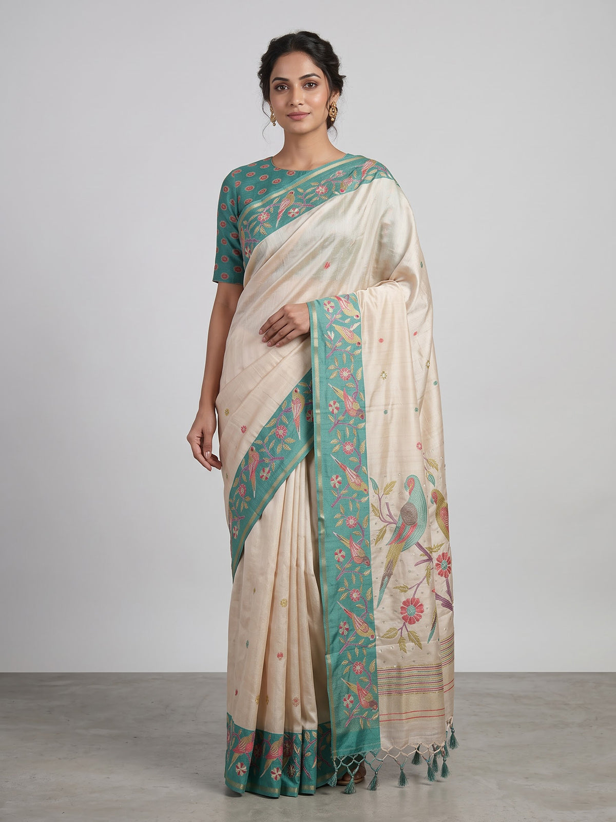 Beige and green art tusser silk saree with elegant bird motifs