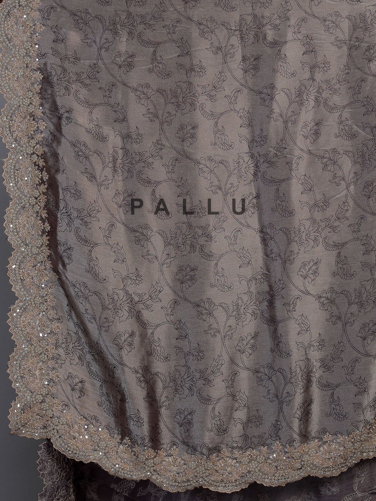 Pastel grey tissue silk saree with delicate pearl zari embellishments