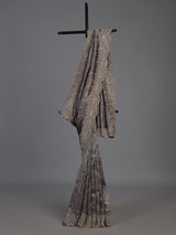 Pastel grey tissue silk saree with delicate pearl zari embellishments