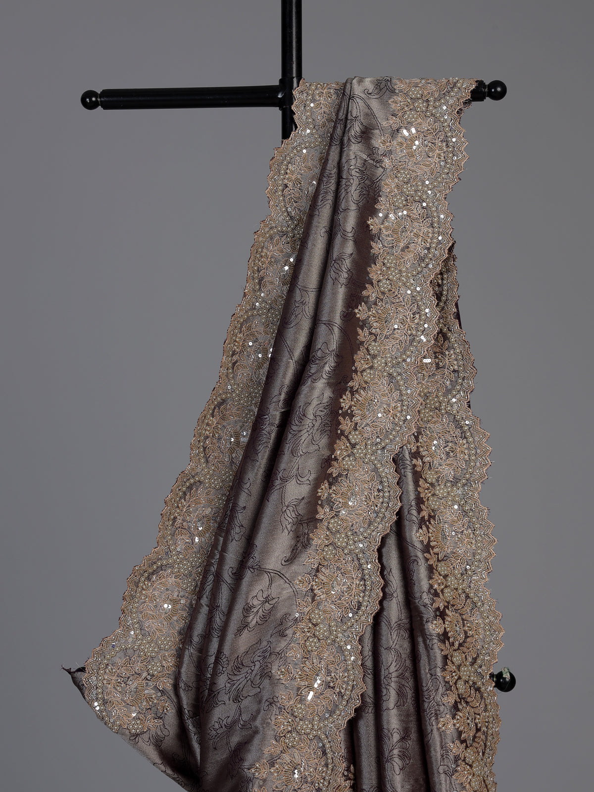 Pastel grey tissue silk saree with delicate pearl zari embellishments