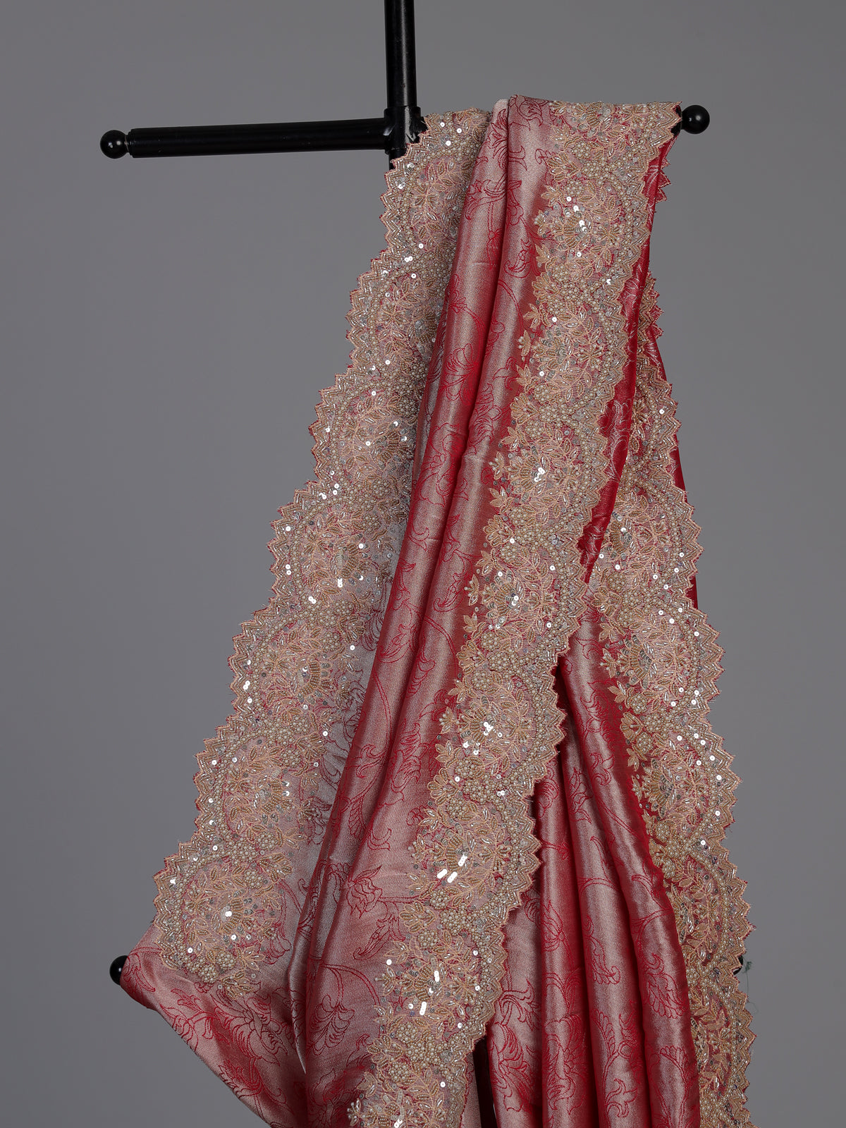 Pastel rani pink tissue silk saree with luxurious zari detailing