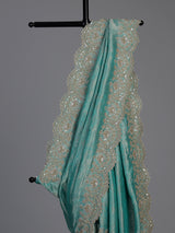 Pastel rama green tissue silk saree with elegant embellishments