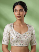 White silk lehenga choli featuring graceful birds and contrast dupatta