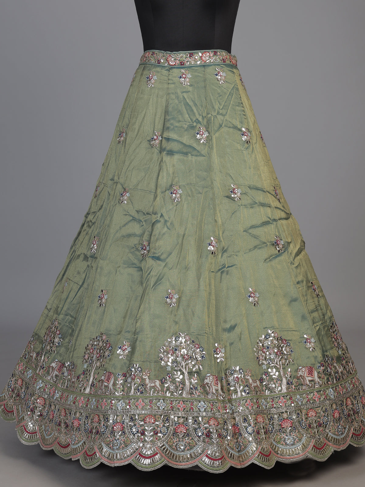 Sage green silk lehenga choli with exquisite animal artistry