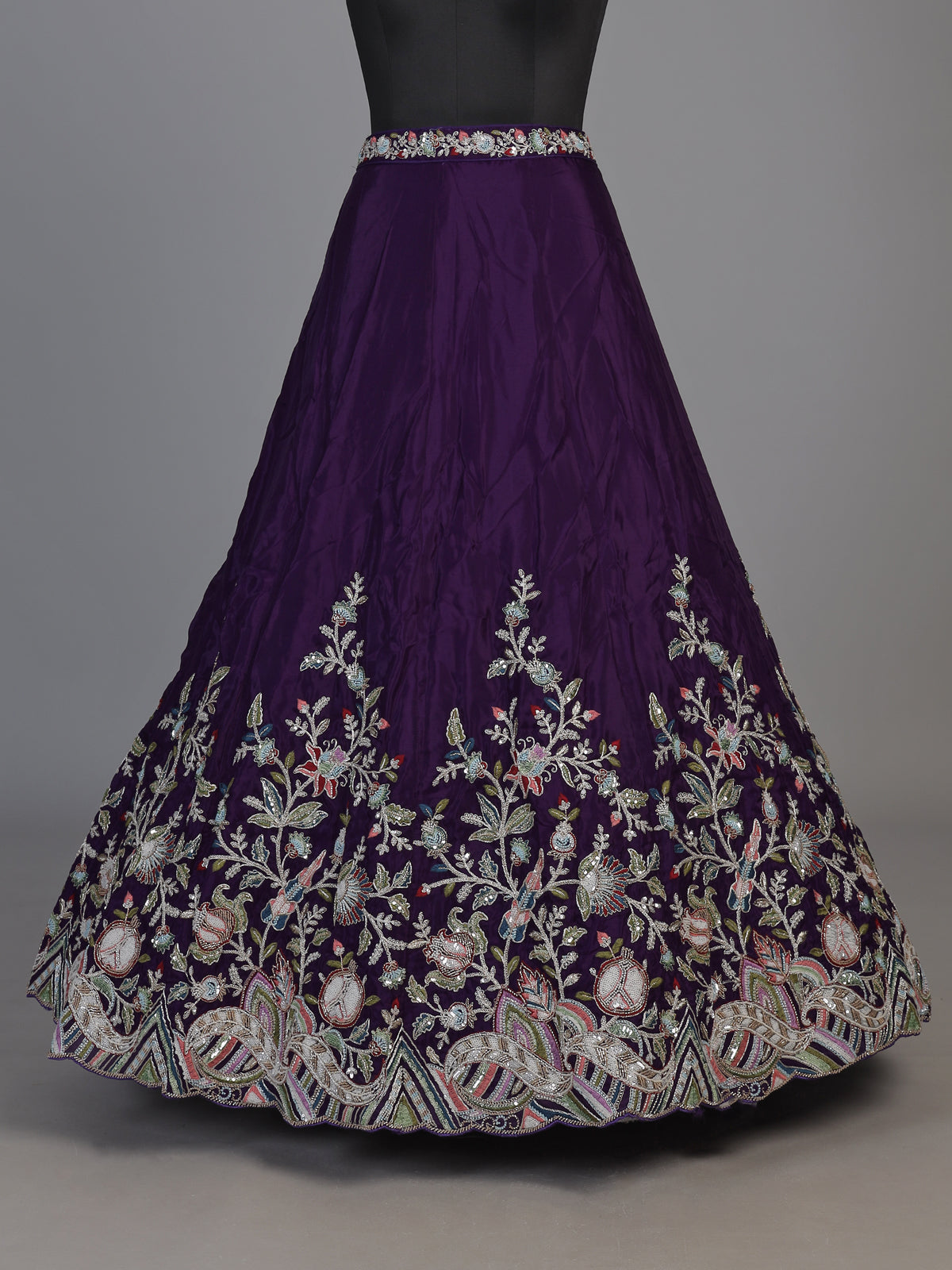 Royal purple silk lehenga choli with intricate festive craftsmanship