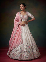 White tissue silk lehenga choli featuring exquisite zardosi embellishments