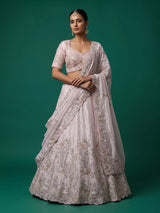 Pink tissue silk lehenga choli adorned with floral bird artistry