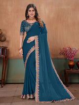 Peacock blue graceful embroidered satin festive saree