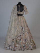 Beige tissue silk lehenga choli with luxurious designer embellishments