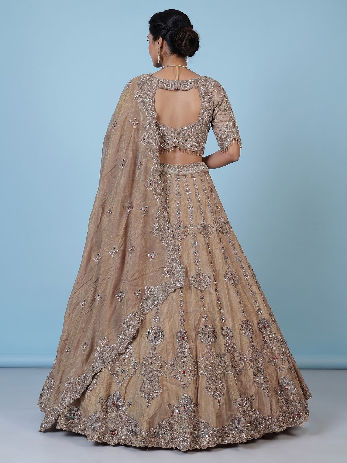 Beige silk lehenga choli with shimmering diamond stone embellishments