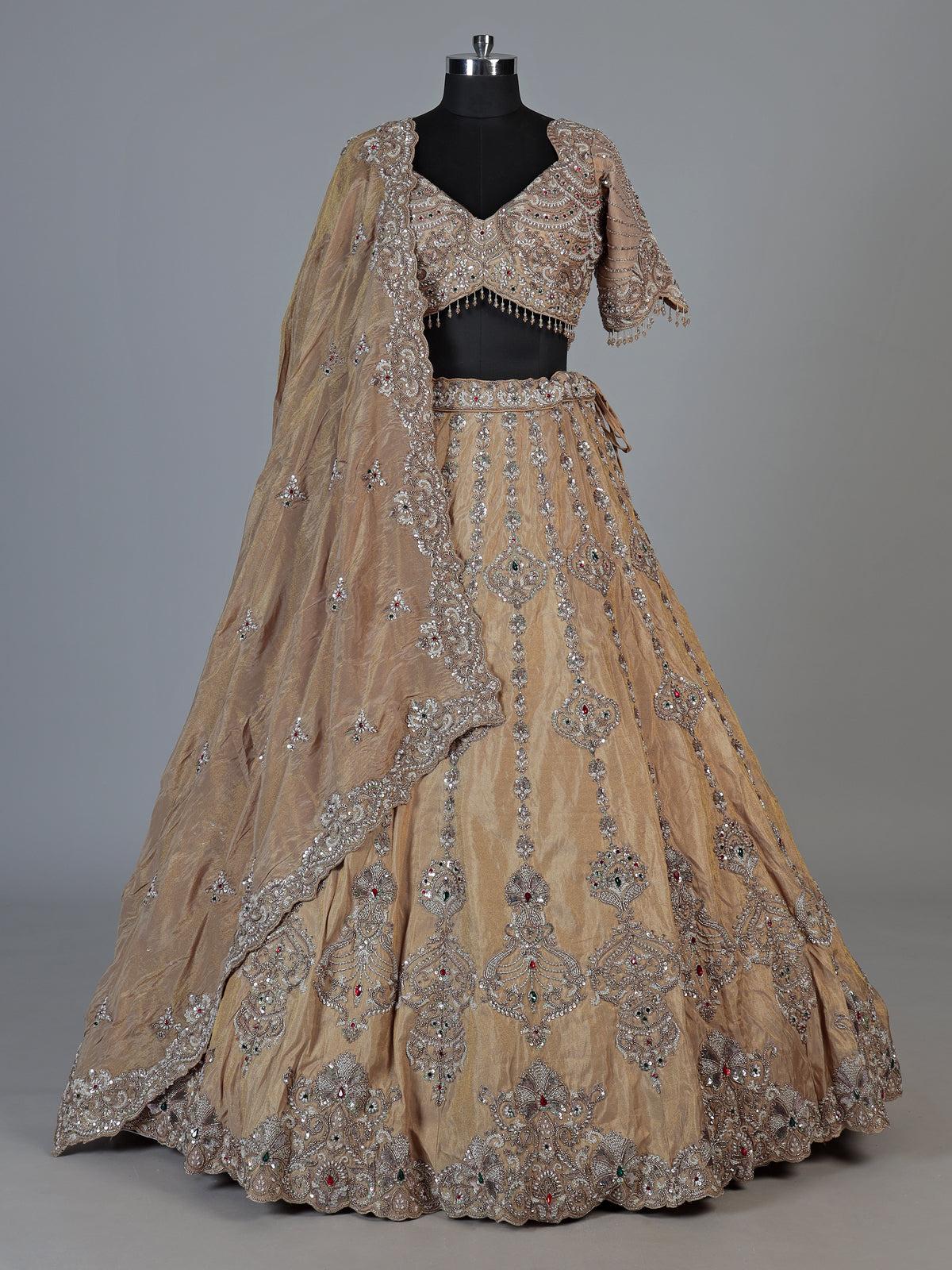 Beige silk lehenga choli with shimmering diamond stone embellishments