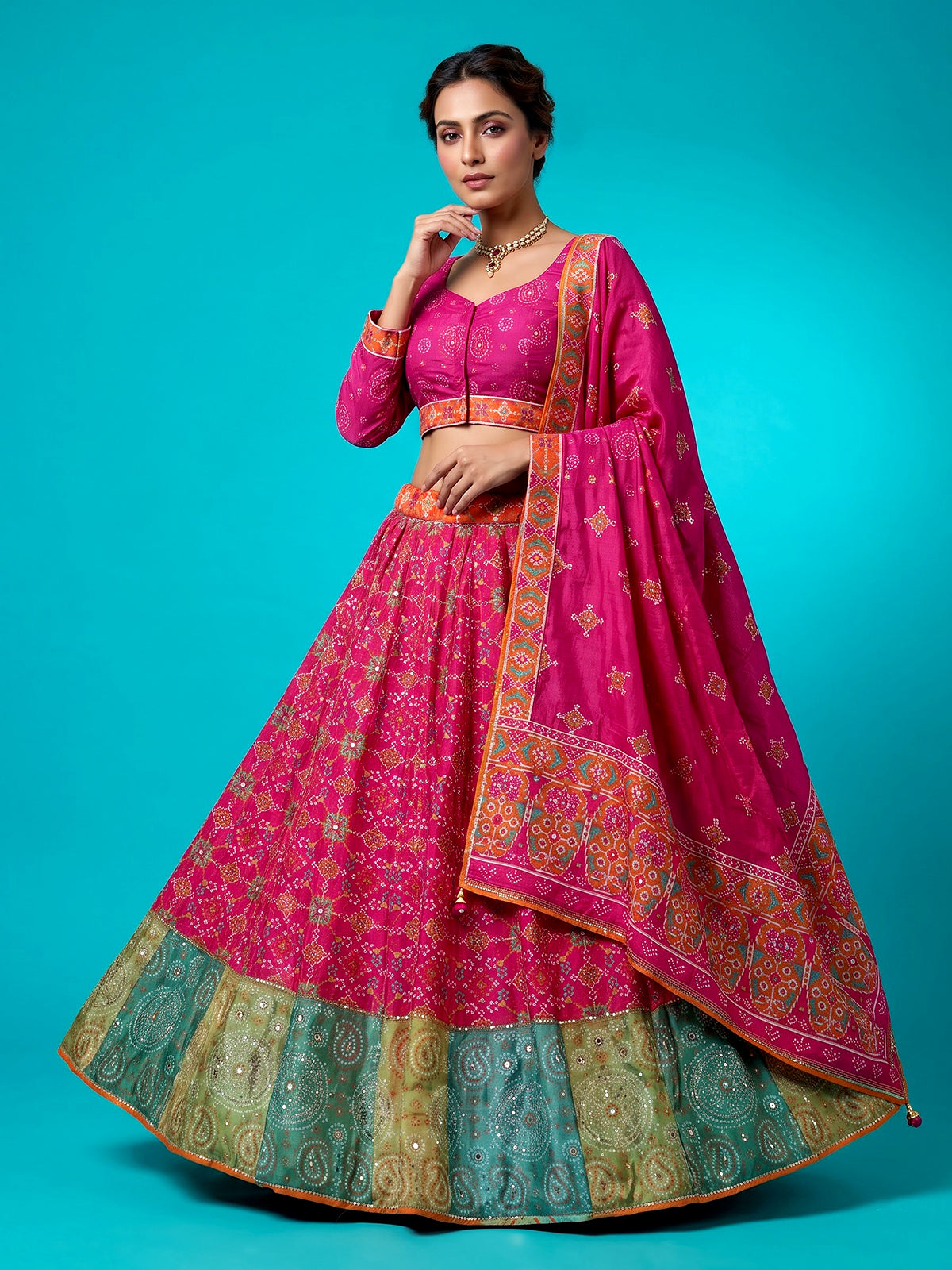 Rani pink silk unstitched lehenga choli with patola artistry