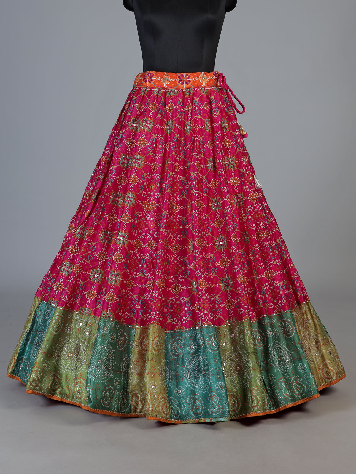 Rani pink silk unstitched lehenga choli with patola artistry