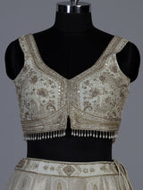 Cream jacquard brocade lehenga choli with lavish embellishments