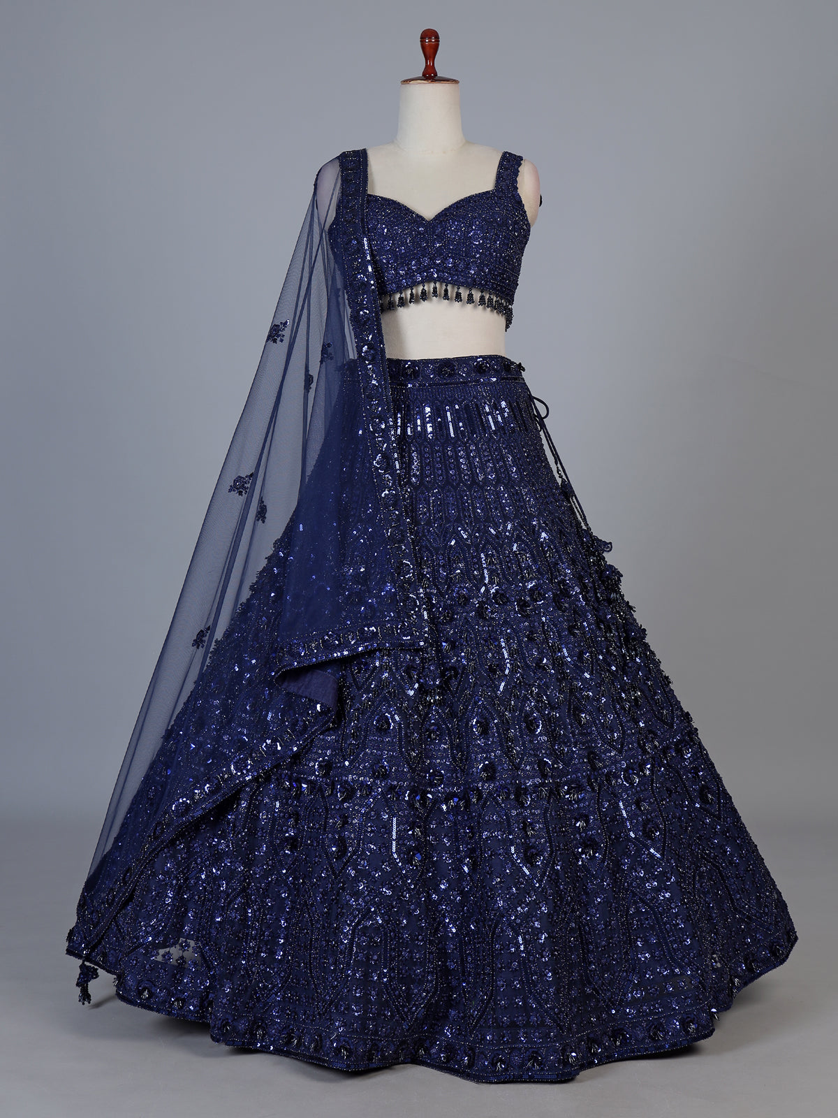 Blue net lehenga choli with intricate pearl cutdana embellishments