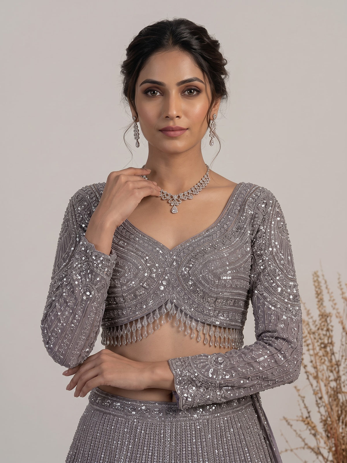 Lavender purple net lehenga choli with sparkling diamond tassel detailing