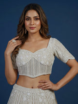 White net lehenga choli with delicate cutdana sequins detailing