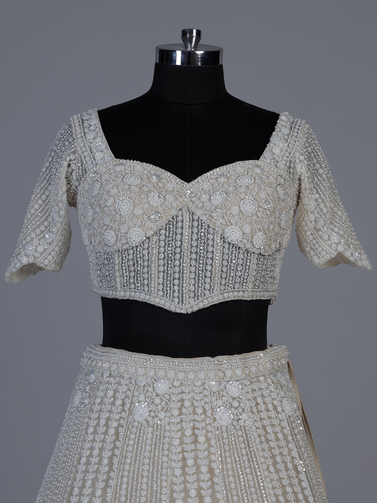 White net lehenga choli with delicate cutdana sequins detailing