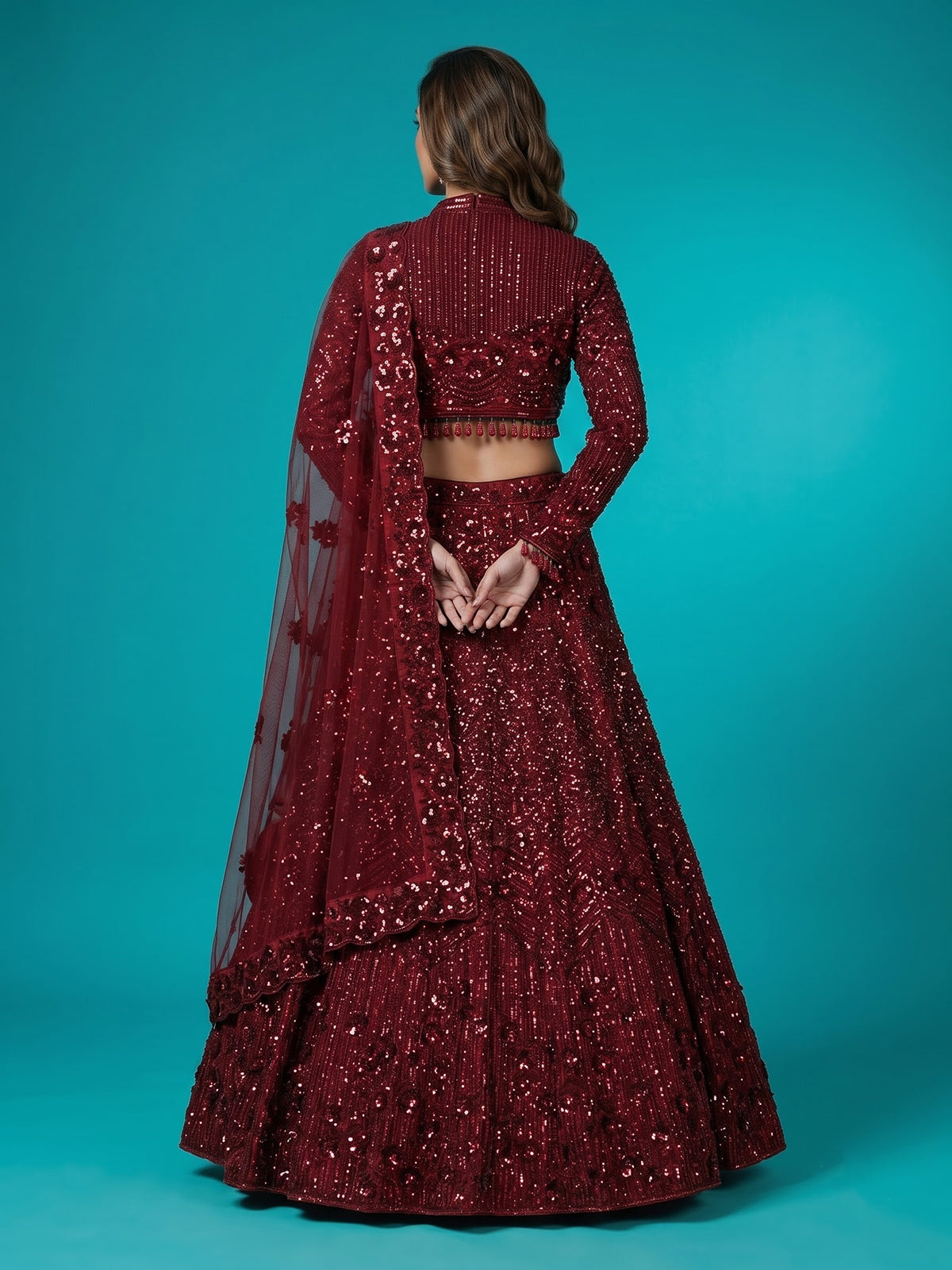 Maroon net lehenga choli with luxurious pearl cutdana embellishments
