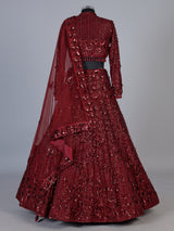 Maroon net lehenga choli with luxurious pearl cutdana embellishments