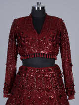 Maroon net lehenga choli with luxurious pearl cutdana embellishments