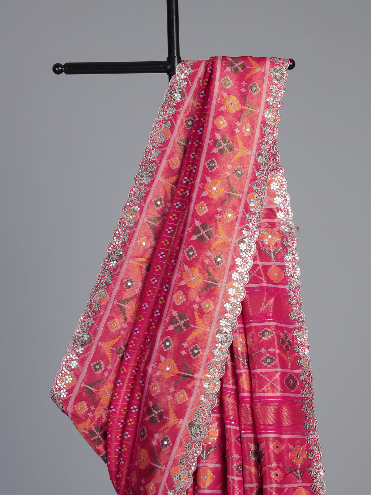 Rani pink soft silk saree with vibrant ikat printed elegance