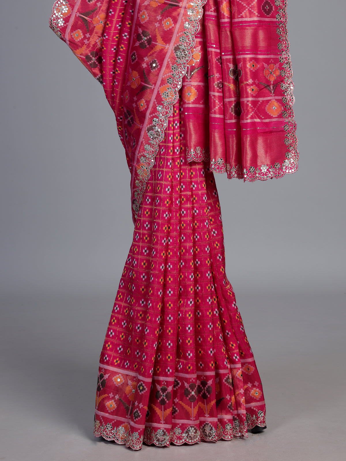 Rani pink soft silk saree with vibrant ikat printed elegance