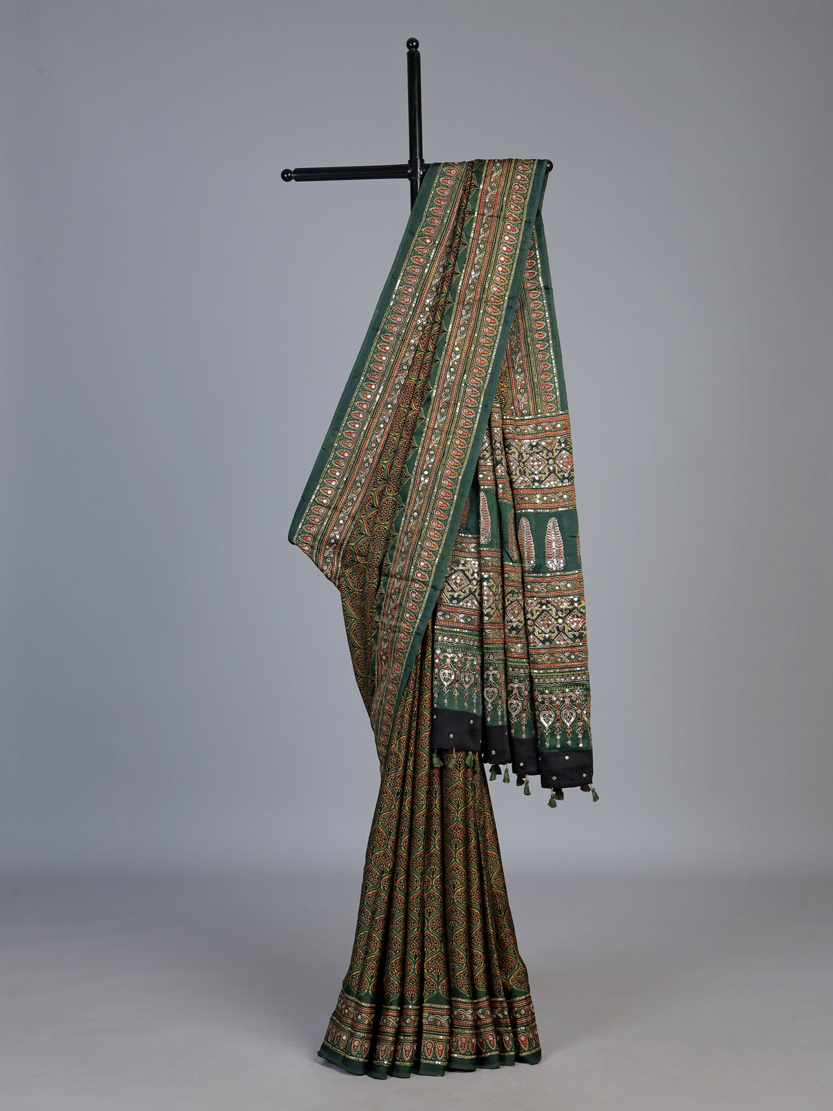 Green crepe silk saree with graceful printed festive detailing