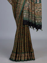 Green crepe silk saree with graceful printed festive detailing