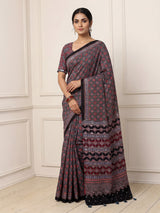 Blue and black crepe silk saree with artistic printed detailing