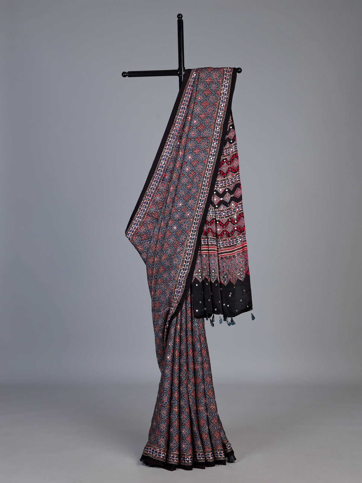 Blue and black crepe silk saree with artistic printed detailing