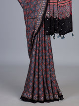 Blue and black crepe silk saree with artistic printed detailing