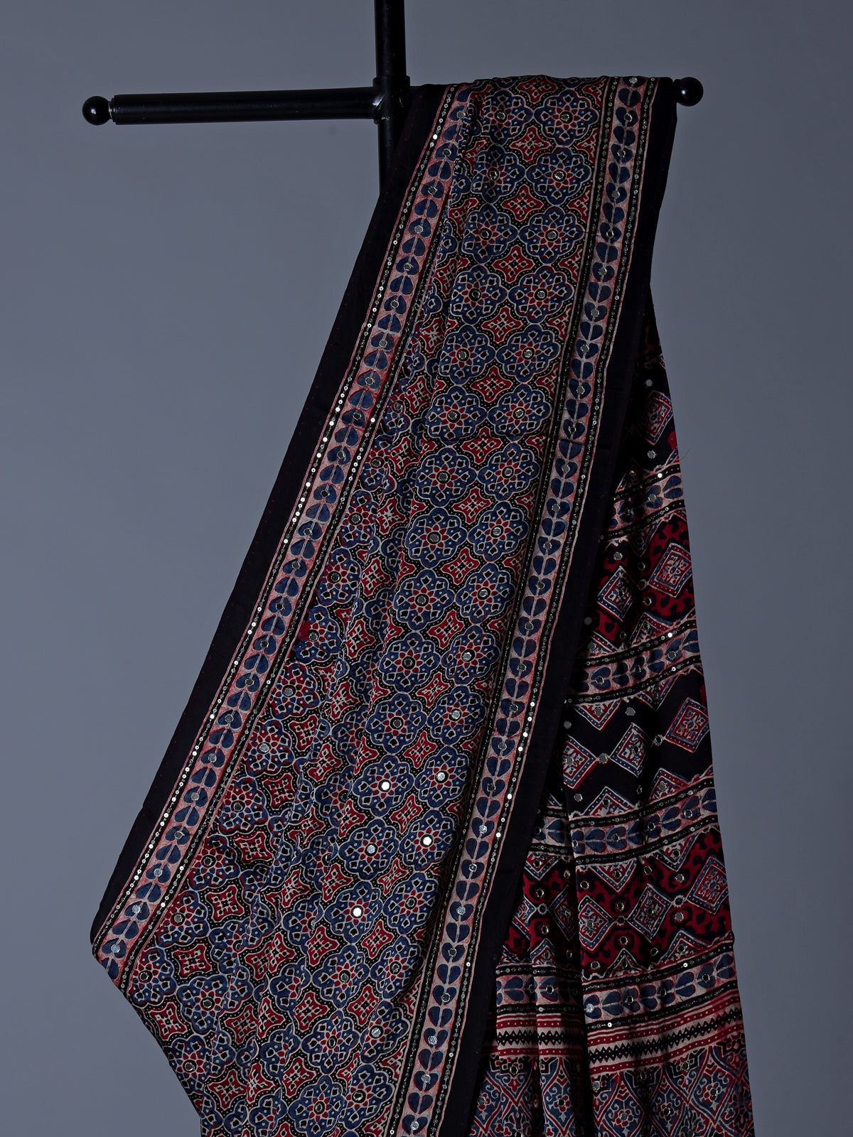 Blue and black crepe silk saree with artistic printed detailing