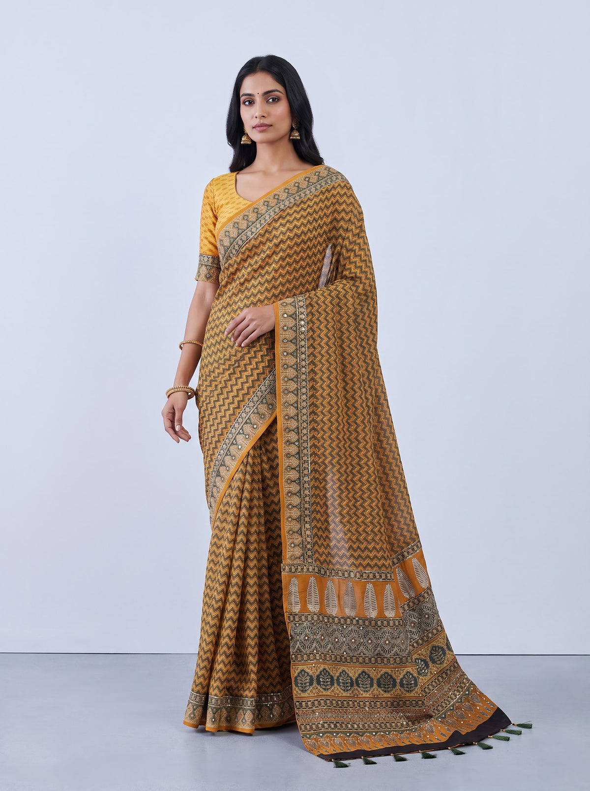 Mustard yellow crepe silk saree with zigzag printed elegance