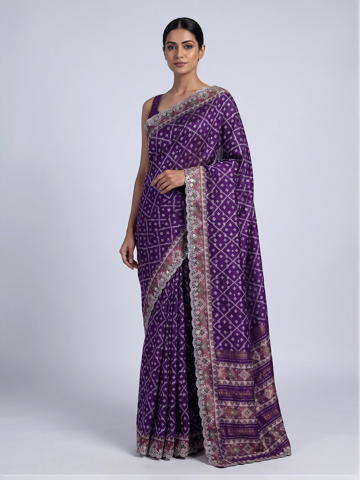 Purple soft silk saree with shimmering ikat printed embellishments