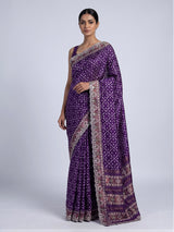 Purple soft silk saree with shimmering ikat printed embellishments