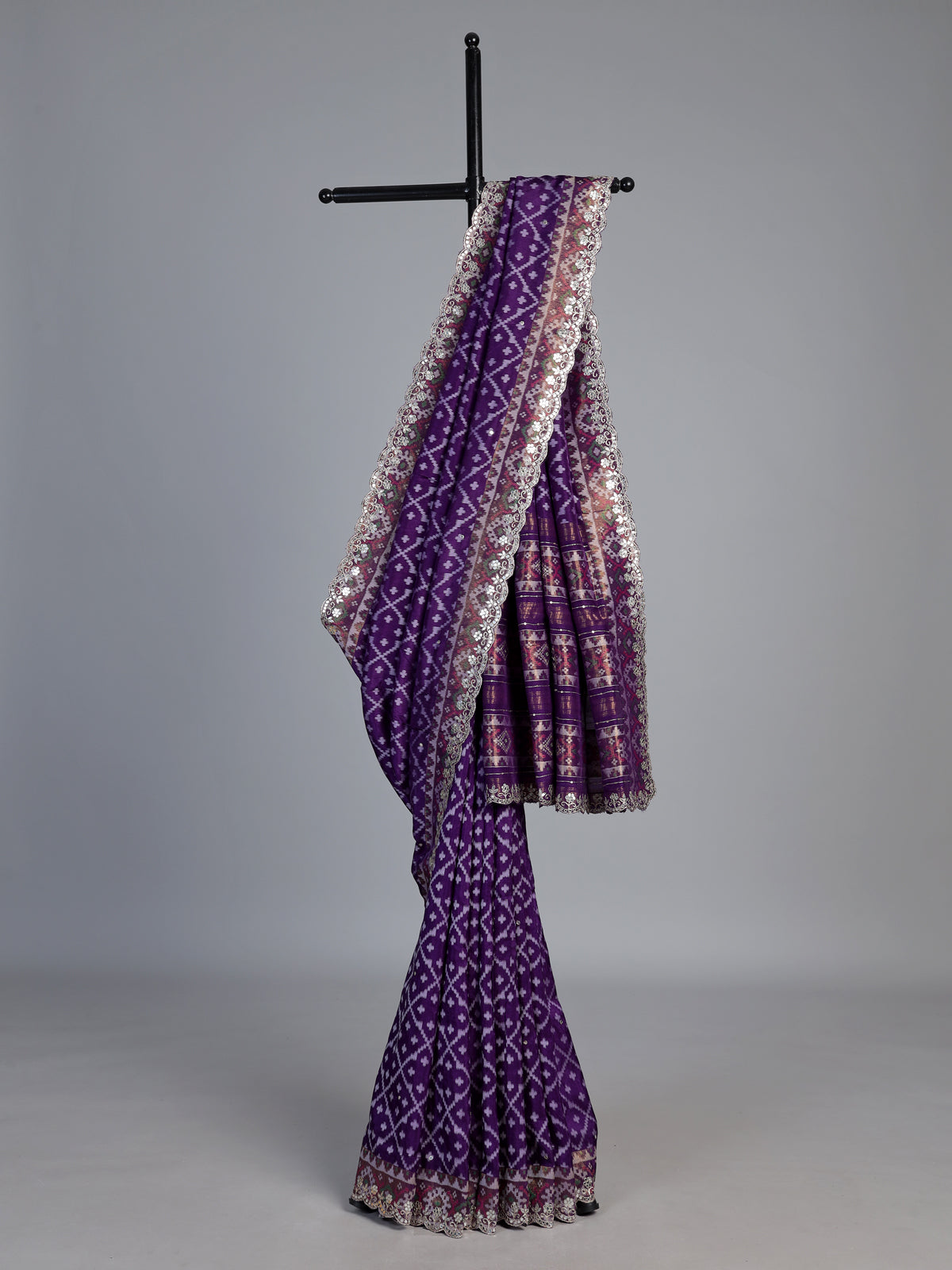 Purple soft silk saree with shimmering ikat printed embellishments