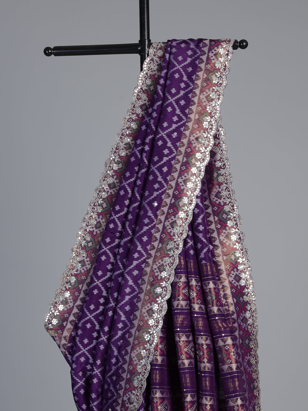 Purple soft silk saree with shimmering ikat printed embellishments